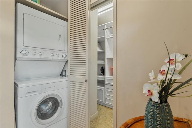 washroom with laundry area and stacked washing maching and dryer