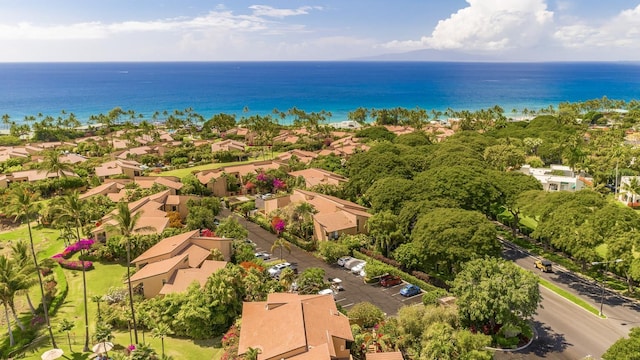 birds eye view of property featuring a water view and a residential view