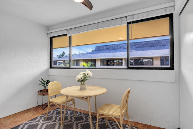 dining space with a textured wall