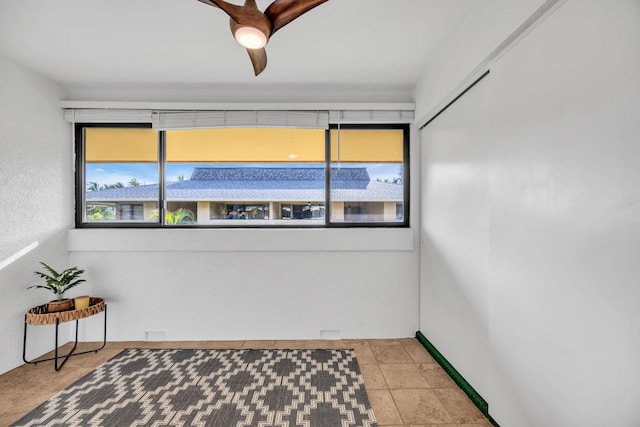 spare room featuring a ceiling fan