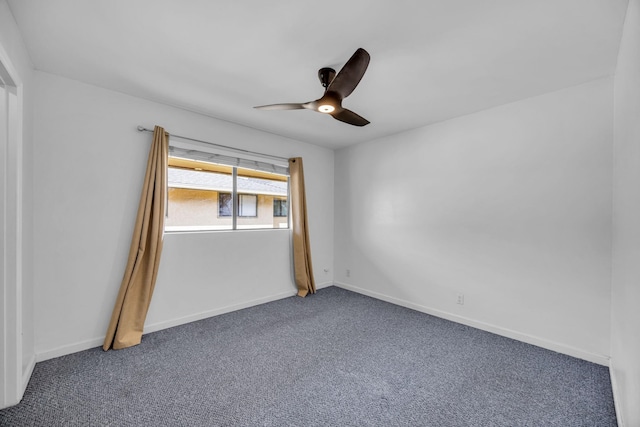 unfurnished room featuring carpet flooring, baseboards, and ceiling fan