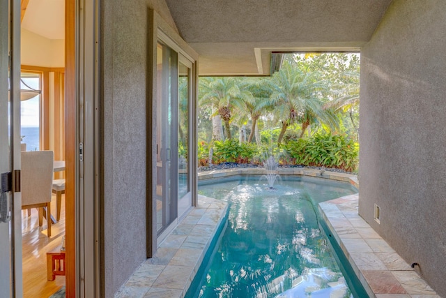 view of pool featuring pool water feature