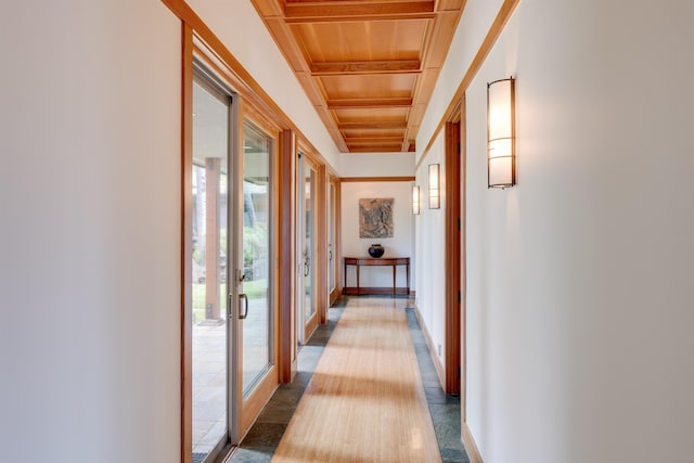 hallway with beam ceiling, french doors, wood ceiling, and plenty of natural light