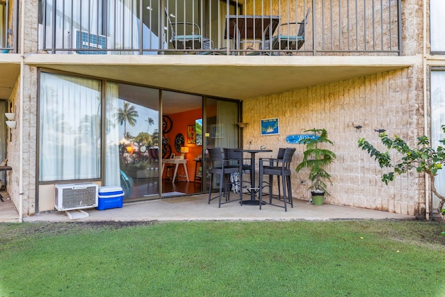 view of patio / terrace with a wall mounted AC