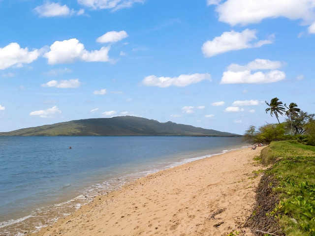 property view of water featuring a view of the beach and a mountain view