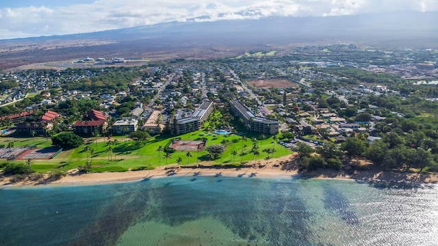 drone / aerial view featuring a water view and a beach view