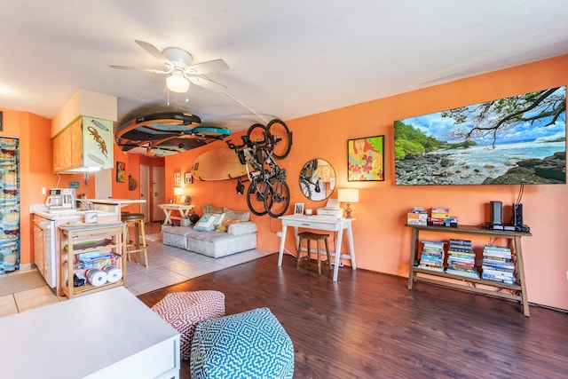 living room with hardwood / wood-style floors and ceiling fan