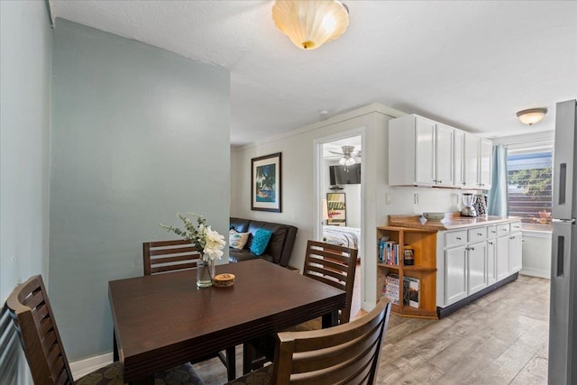 dining space with light wood-type flooring