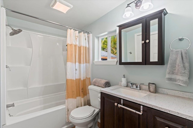 full bathroom with shower / bath combination with curtain, toilet, and vanity