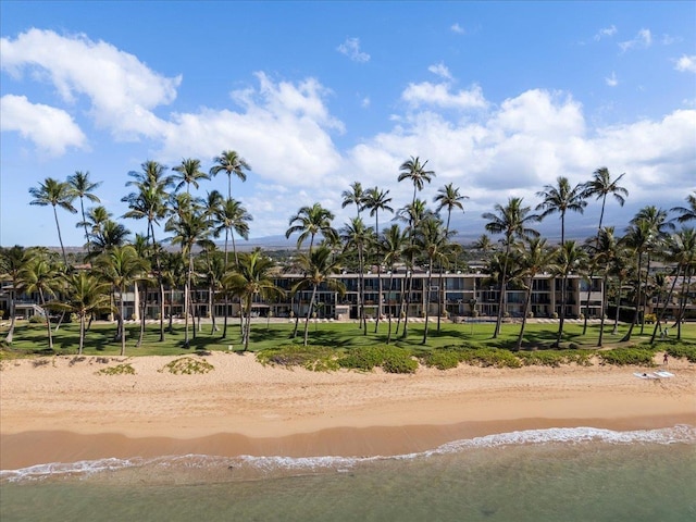 view of property's community featuring a beach view