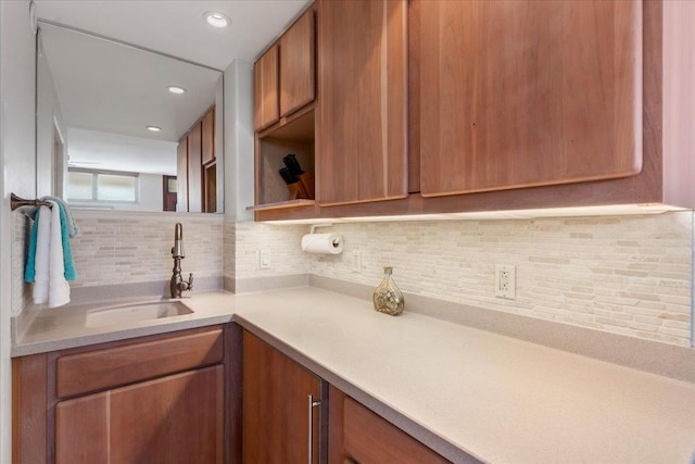 kitchen featuring backsplash and sink