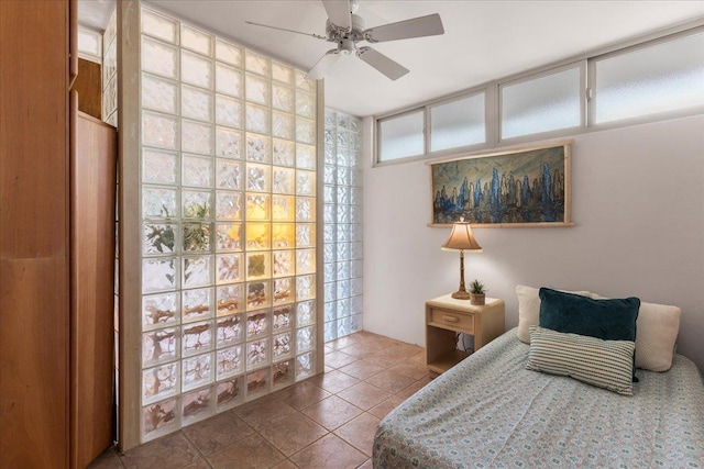 tiled bedroom with ceiling fan