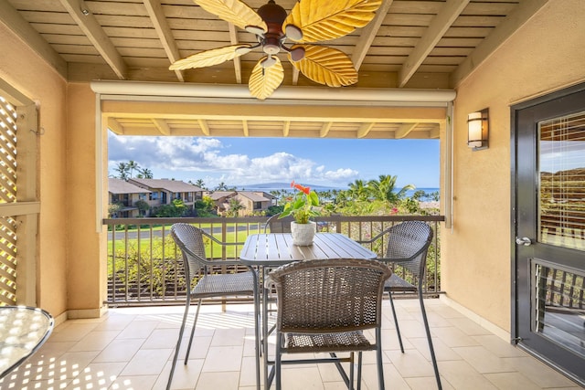 exterior space with ceiling fan