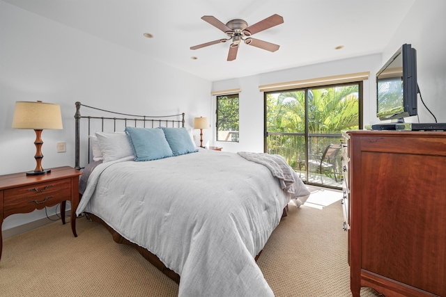 bedroom with access to exterior, light colored carpet, and ceiling fan