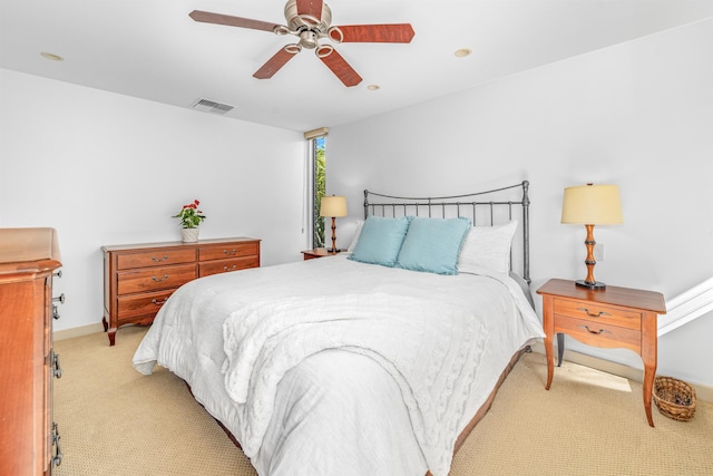 bedroom with light carpet and ceiling fan