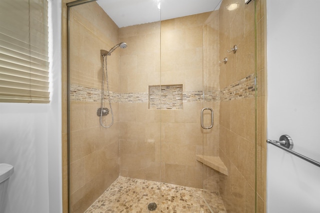 bathroom featuring an enclosed shower