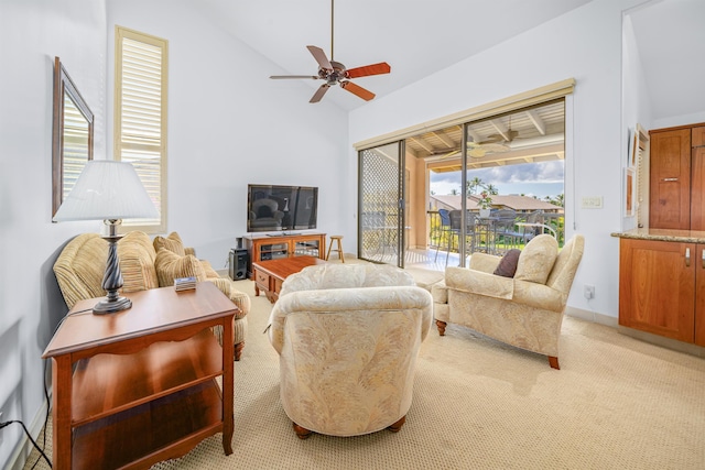 carpeted living room featuring ceiling fan and lofted ceiling