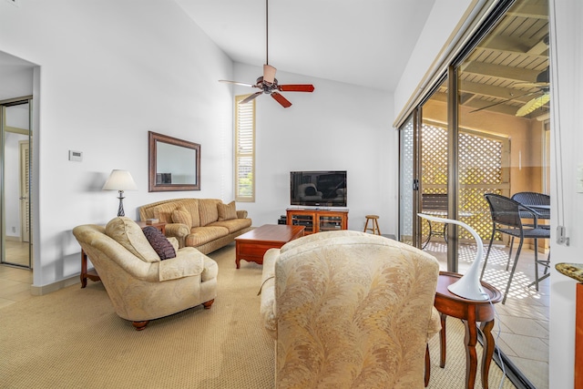 living room with tile patterned floors, ceiling fan, and vaulted ceiling