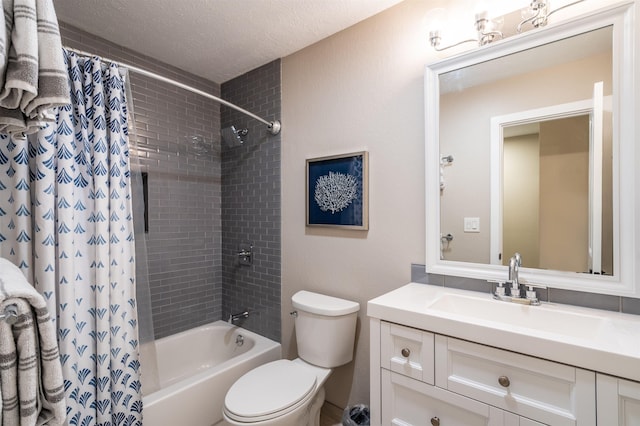 full bathroom with vanity, shower / tub combo, a textured ceiling, and toilet