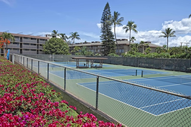 view of sport court featuring fence
