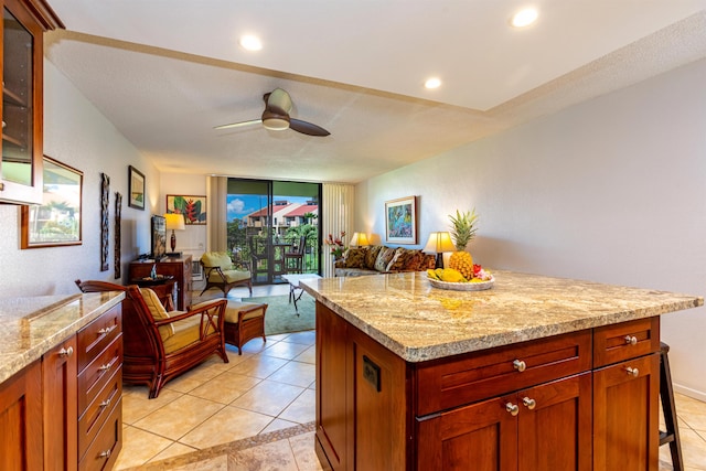 kitchen featuring floor to ceiling windows, glass insert cabinets, light tile patterned flooring, ceiling fan, and open floor plan