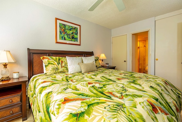 bedroom with a textured ceiling and ceiling fan