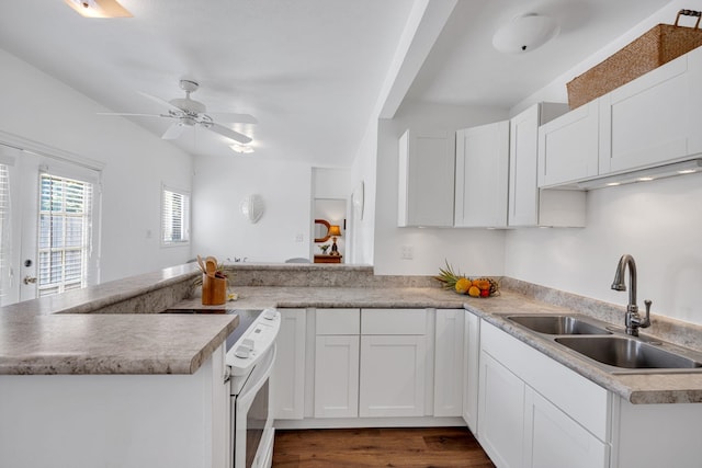 317 Kenolio Rd, Kihei, HI 96753 - kitchen with white range with electric stovetop, white cabinetry, a sink, and a peninsula