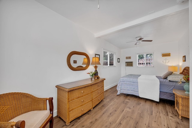 317 Kenolio Rd, Kihei, HI 96753 - bedroom with baseboards, beamed ceiling, ceiling fan, and light wood-type flooring