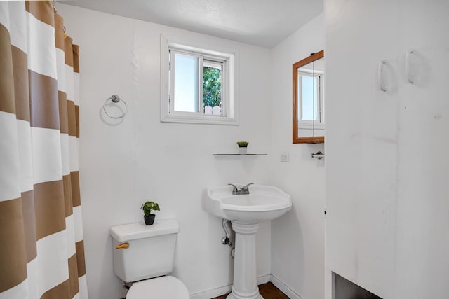 317 Kenolio Rd, Kihei, HI 96753 - bathroom featuring toilet and curtained shower