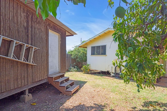 317 Kenolio Rd, Kihei, HI 96753 - view of yard with fence, an outdoor structure, and entry steps