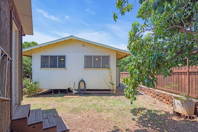 317 Kenolio Rd, Kihei, HI 96753 - rear view of house featuring fence