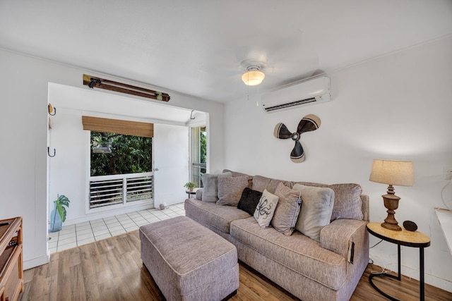 317 Kenolio Rd, Kihei, HI 96753 - living area featuring a wall mounted AC, wood finished floors, and ceiling fan