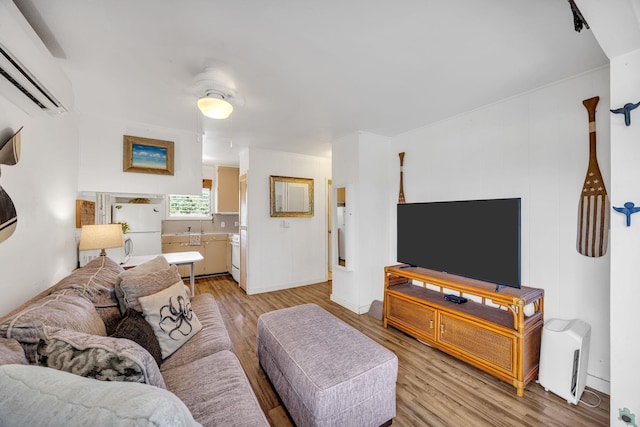317 Kenolio Rd, Kihei, HI 96753 - living area with a wall unit AC and light wood finished floors