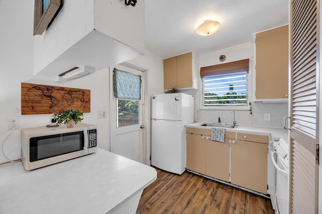 317 Kenolio Rd, Kihei, HI 96753 - kitchen featuring white appliances, light countertops, light wood-style flooring, and a sink
