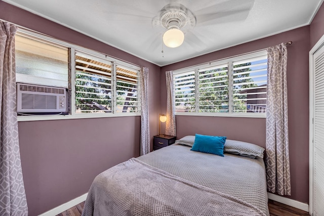 317 Kenolio Rd, Kihei, HI 96753 - bedroom featuring cooling unit, a ceiling fan, baseboards, and wood finished floors