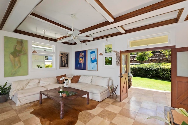 living room featuring beamed ceiling, light tile flooring, ceiling fan, and a wealth of natural light