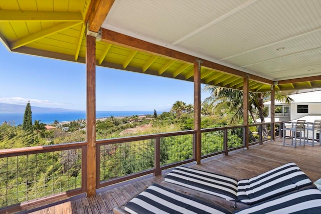 wooden terrace with a water view