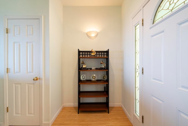 foyer entrance with light hardwood / wood-style floors