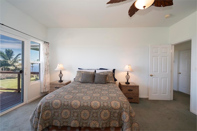 bedroom featuring access to outside, dark carpet, and ceiling fan