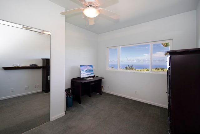 office space featuring ceiling fan and dark carpet