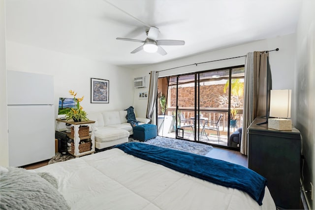 bedroom with ceiling fan, access to exterior, light hardwood / wood-style flooring, white refrigerator, and an AC wall unit