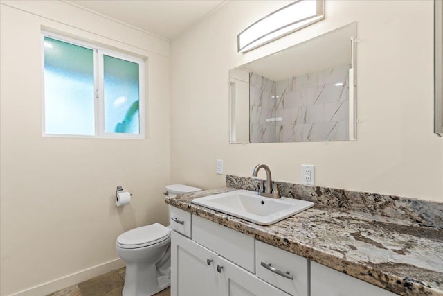 bathroom featuring tile patterned flooring, vanity, toilet, and walk in shower