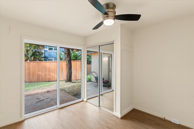 interior space with hardwood / wood-style floors and ceiling fan