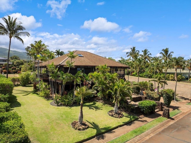 41 Pihaa St, Lahaina, HI 96761 - view of front of property with a front lawn and a tiled roof