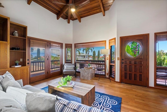 41 Pihaa St, Lahaina, HI 96761 - living room featuring high vaulted ceiling, a ceiling fan, wood finished floors, a wooden ceiling with exposed beams, and french doors