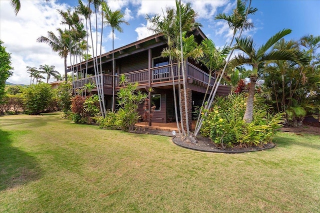 41 Pihaa St, Lahaina, HI 96761 - rear view of property featuring a deck and a lawn