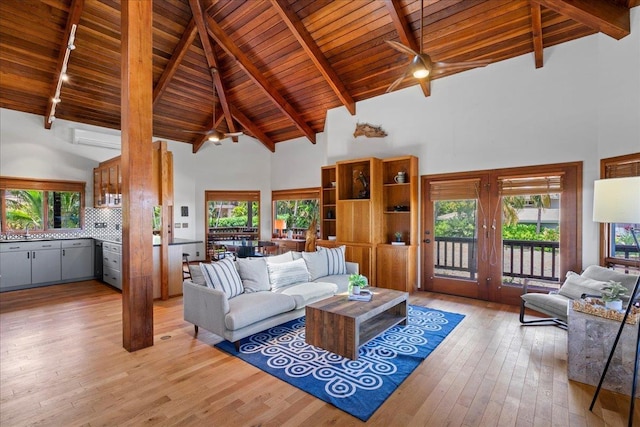 41 Pihaa St, Lahaina, HI 96761 - living area with high vaulted ceiling, a wooden ceiling with exposed beams, light wood finished floors, french doors, and track lighting