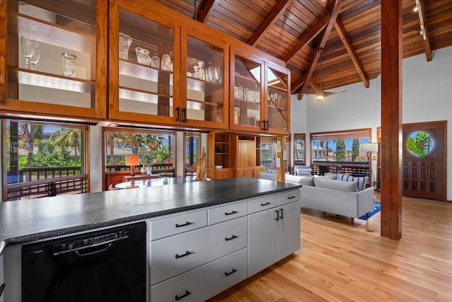 41 Pihaa St, Lahaina, HI 96761 - kitchen with black dishwasher, high vaulted ceiling, a wooden ceiling with exposed beams, dark countertops, and light wood finished floors