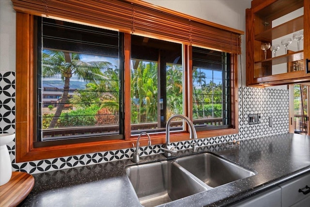 41 Pihaa St, Lahaina, HI 96761 - kitchen featuring decorative backsplash and dark stone counters