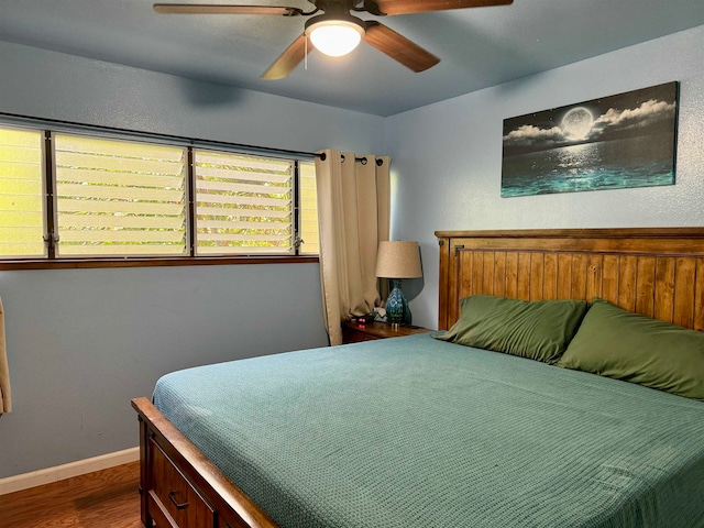 bedroom featuring ceiling fan and wood-type flooring